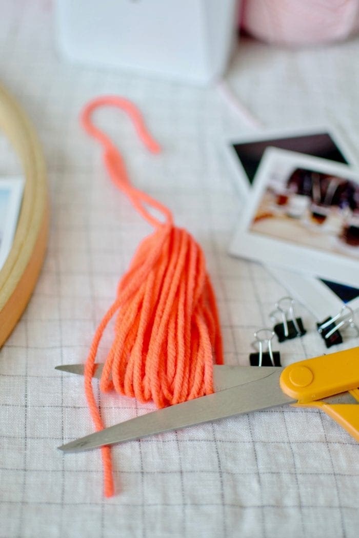 DIY tasseled instax photo Wall Hanger from Dear Handmade Life