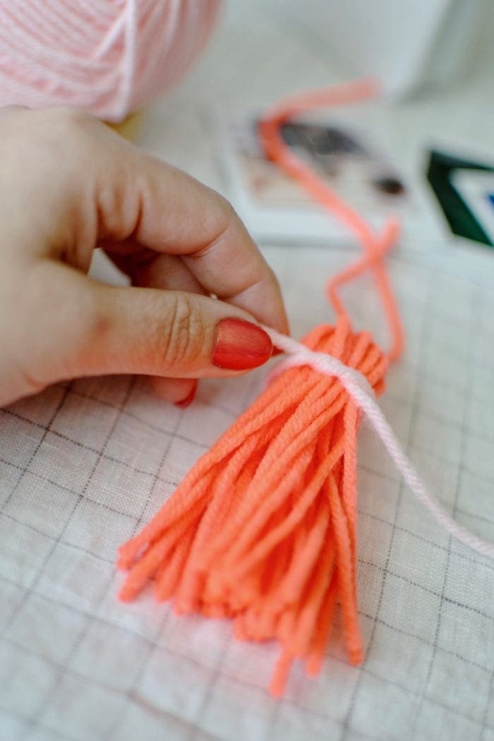 DIY tasseled instax photo Wall Hanger from Dear Handmade Life